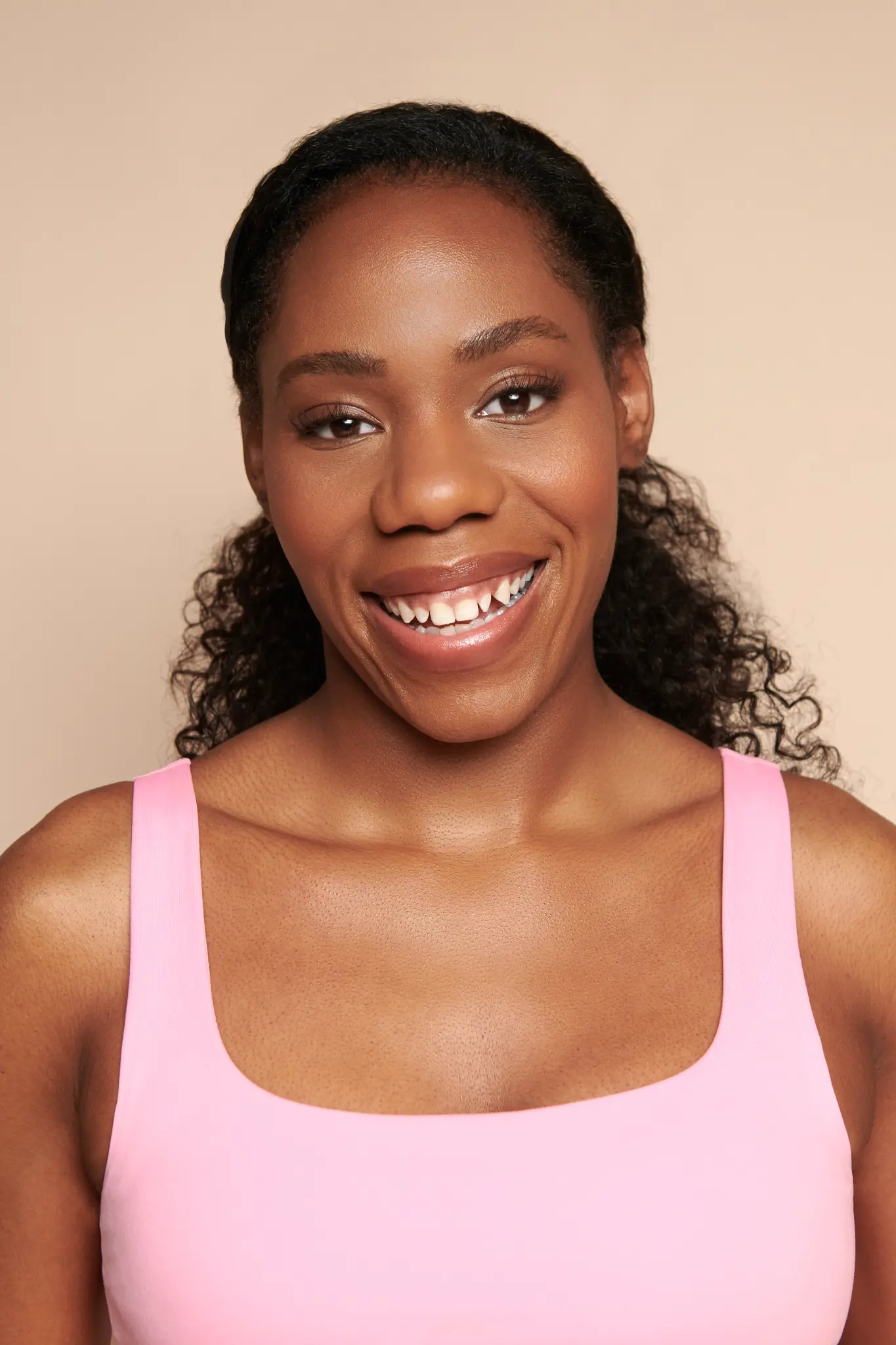 Alesha smiling in pink